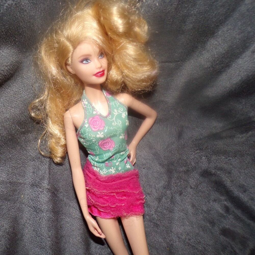 Fashionista blonde Barbie with red nails